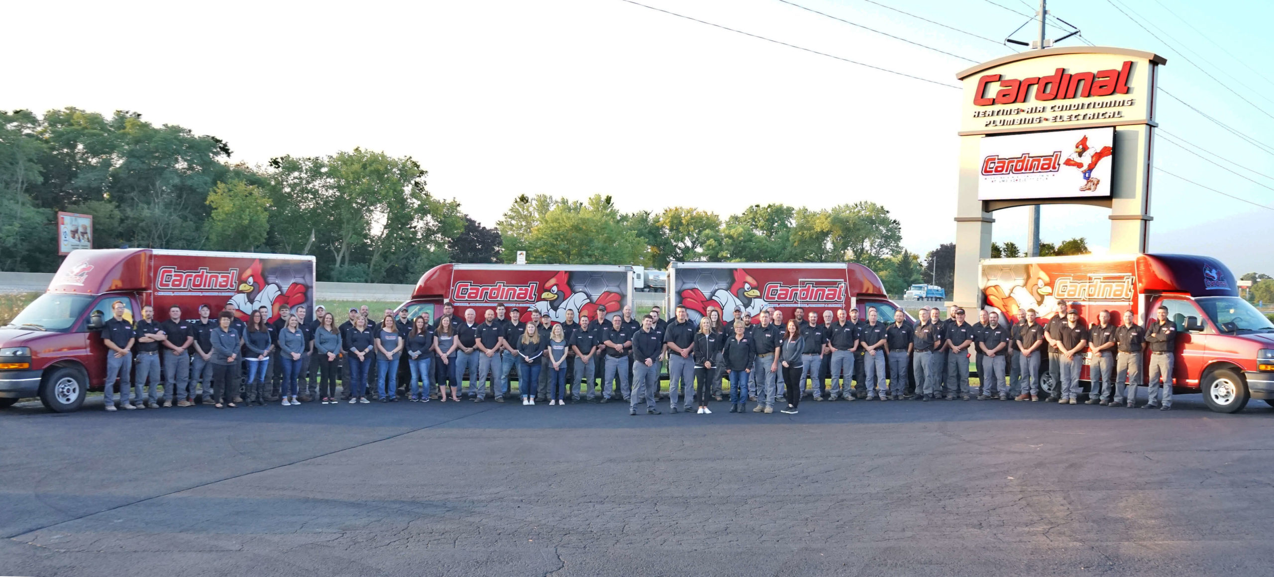 Cardinal Heating, Cooling, Plumbing & Electric employees and trucks