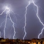 Lightning strikes illuminate a stormy skyline, reflecting the power of nature, perfect for HVAC service promotions.