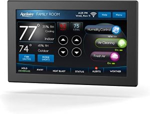 Digital thermostat displaying 77°F, 35% humidity, time/date, and control options for HVAC efficiency and comfort.