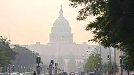 Hazy view of the U.S. Capitol building surrounded by smog, illustrating air quality concerns highlighted in Wisconsin's air quality crisis.